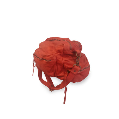 Red backpack on a white background